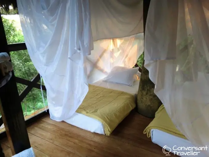 Beds in the canopy jungle treehouse at Inkaterra Reserva Amazonica, Tambopata Peru