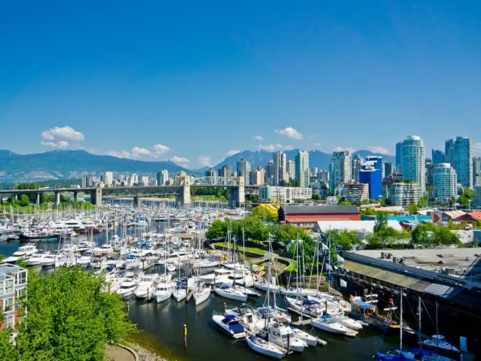 City skyline with skyscrapers and green trees