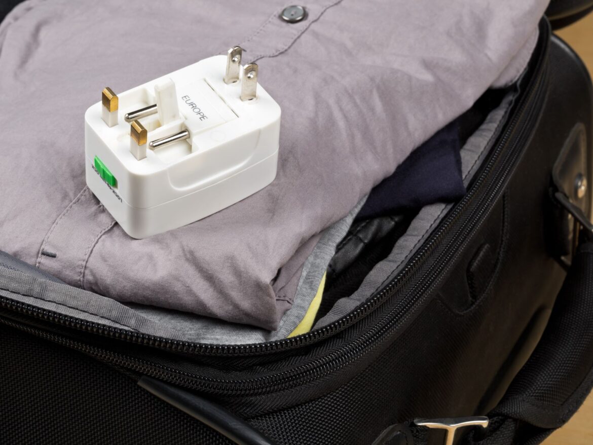 Travel adaptor and suitcase