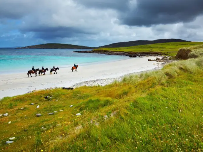 Horse riding on a beach in Ireland
