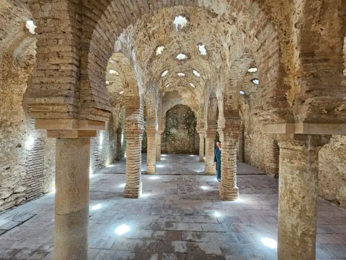 Underground brick building with arches and star-shaped holes in the roof