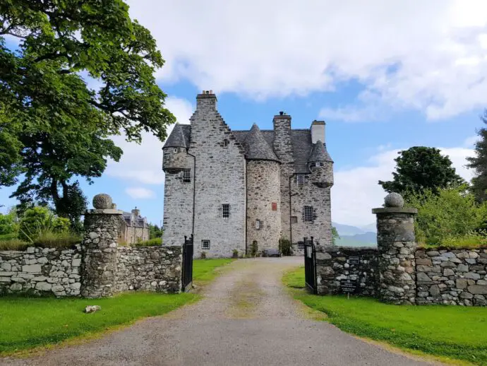 Turreted castle with stone gates to the front