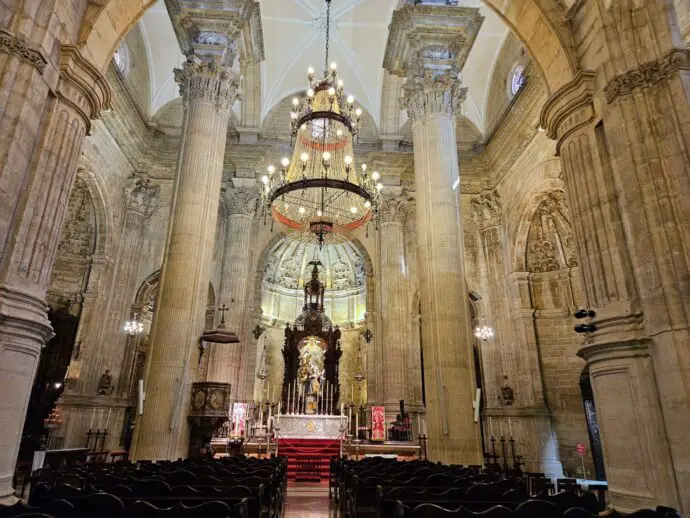 Church with hanging chandelier and tall stone archways