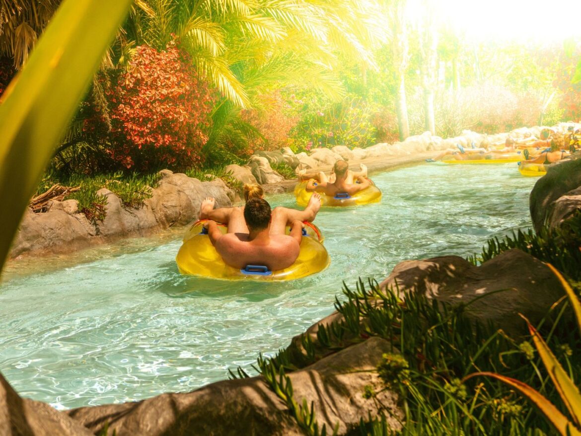 People floating down a river in yellow inflatable tubes