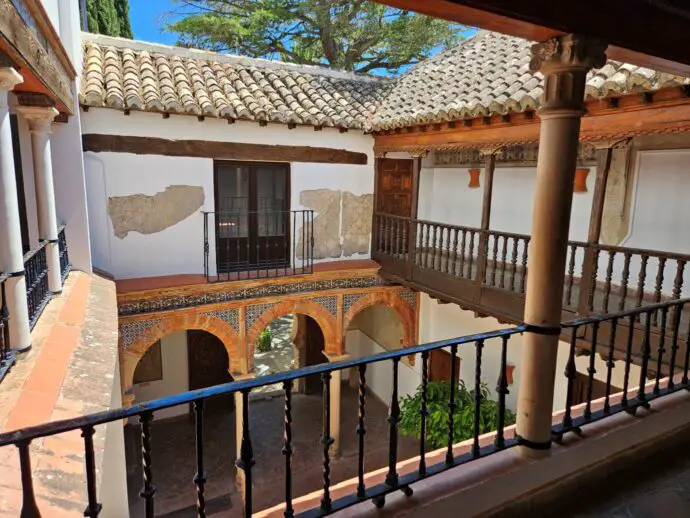 Historic house with balconies overlooking a patio