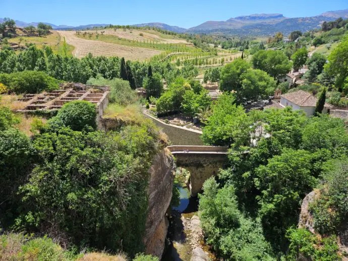 Old stone bridge surrounded by green countryside