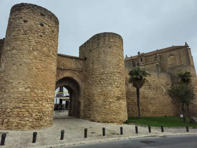 Old stone gateway with two towers on either side